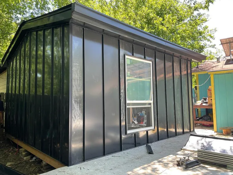 Black standing seam metal wall panels for Roof Inspection in Derby